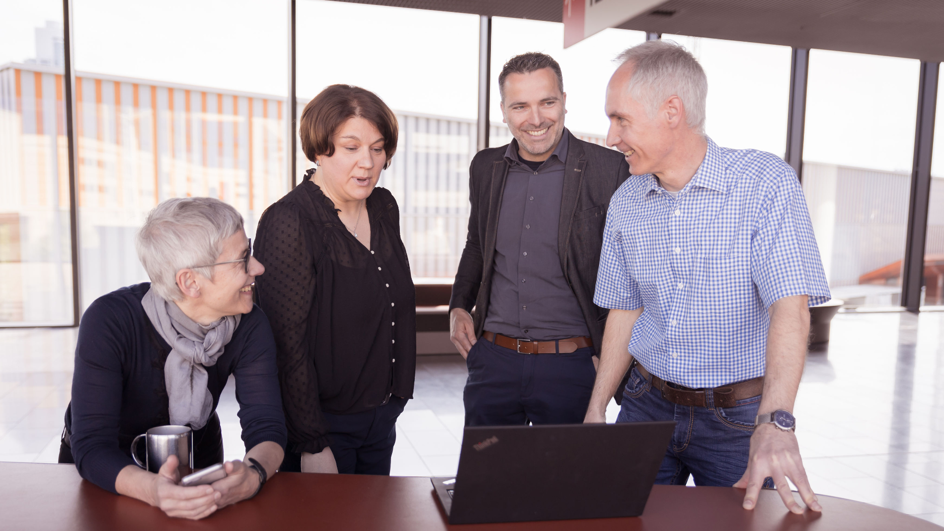 Two men and a woman talking