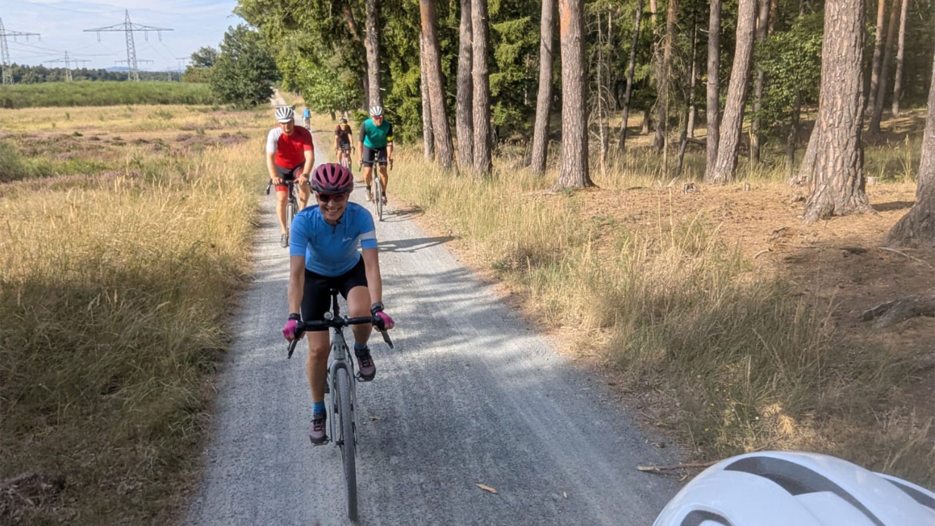 Group of cyclists on a gravel path in the woods